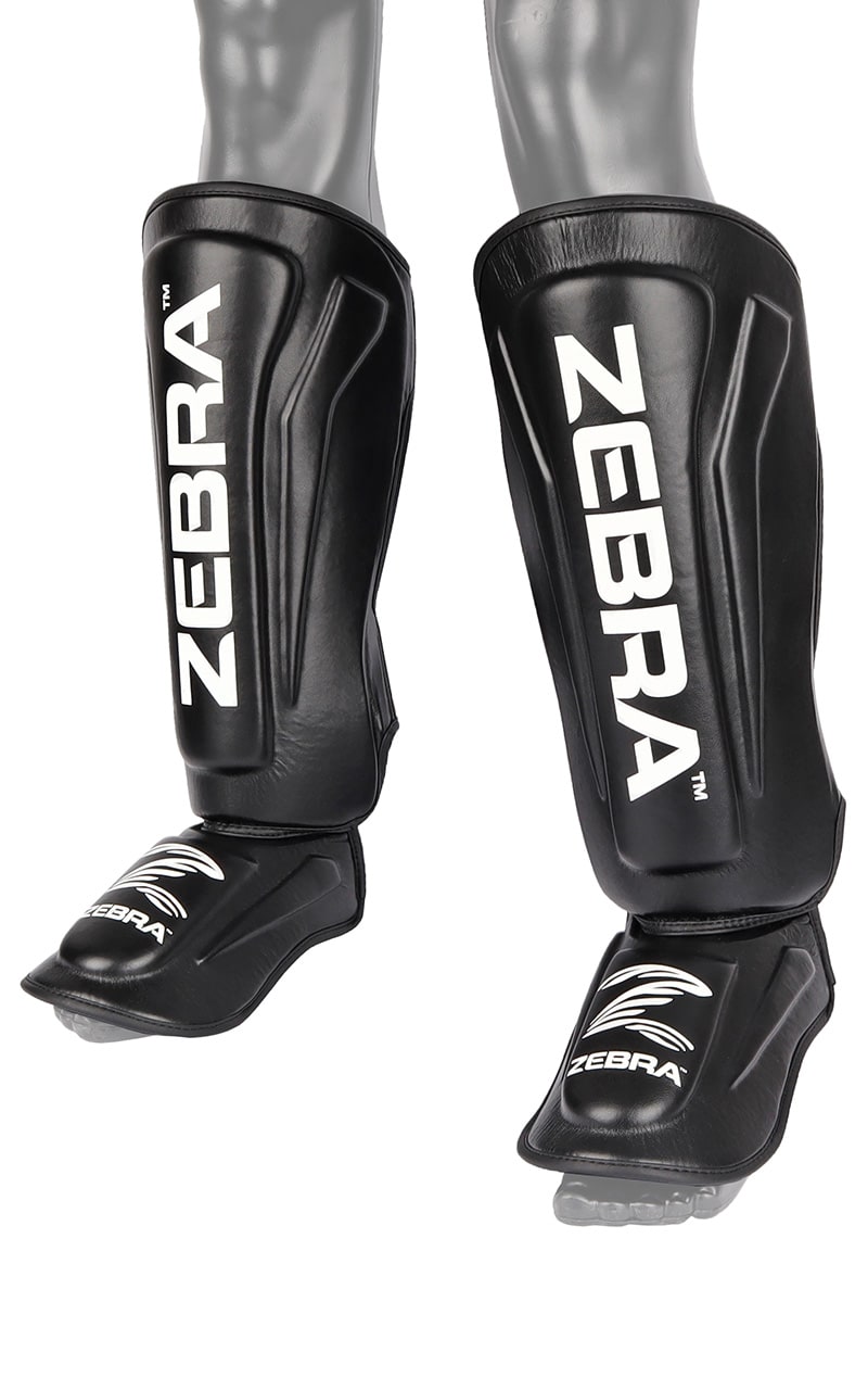 ZEBRA Schienbein- Spannschützer Pro PU - Vorgegrümmt, extra brelte Klettbänder - MMA, Kickboxen