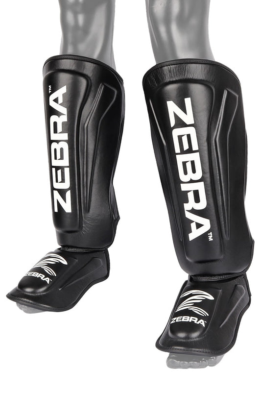 ZEBRA Schienbein- Spannschützer Pro PU - Vorgegrümmt, extra brelte Klettbänder - MMA, Kickboxen