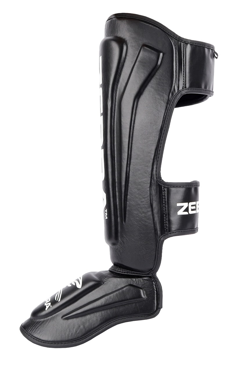 ZEBRA Schienbein- Spannschützer Pro PU - Vorgegrümmt, extra brelte Klettbänder - MMA, Kickboxen